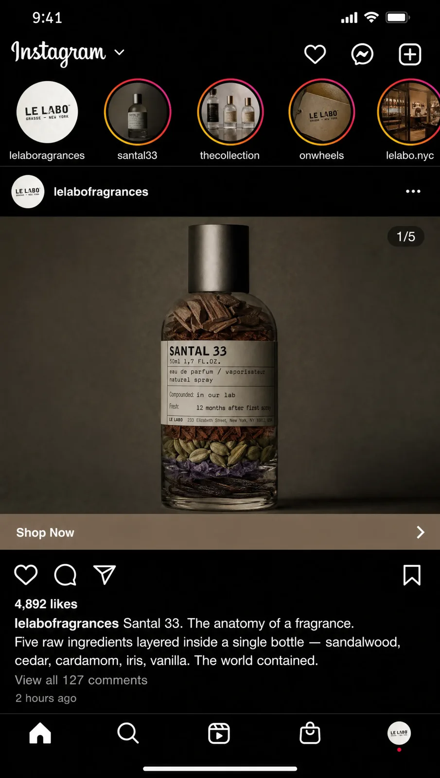 The Le Labo Santal 33 bottle with the five raw ingredients layered inside the glass.